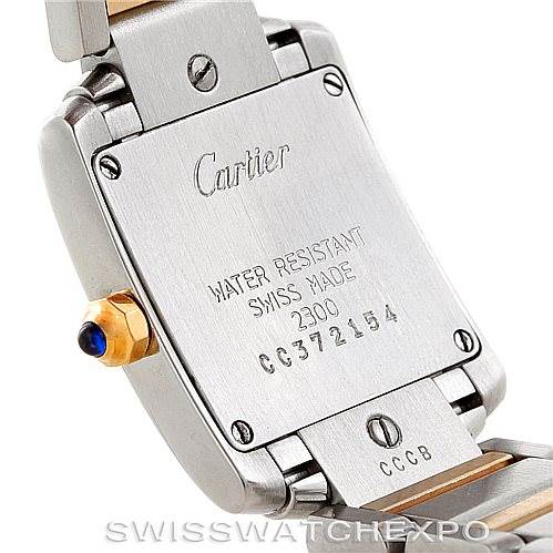 The image shows the back case of a Cartier Tank Francaise W51007Q4 Women's Steel and Gold (two tone) Silver Dial W51007Q4 Women's Steel and Gold (two tone) Silver Dial watch, highlighting the brand engraving and serial number.