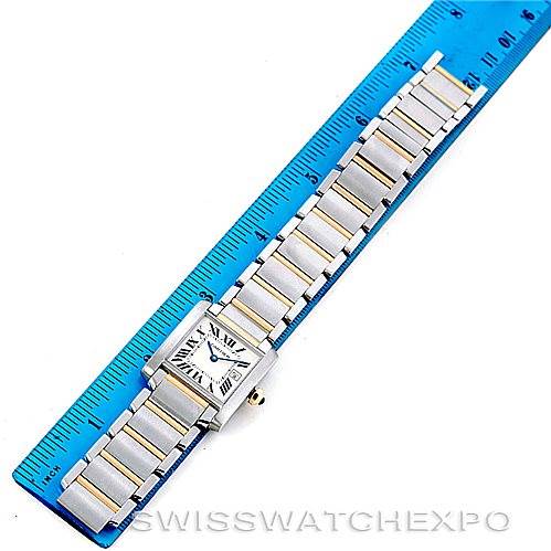 The Cartier Tank Francaise W51012Q4 Women's Steel and Gold (two tone) Silver Dial W51012Q4 Women's Steel and Gold (two tone) Silver Dial watch is shown fully laid flat alongside a blue ruler for scale.