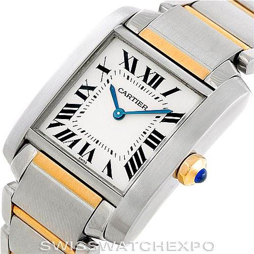 The Cartier Tank Française watch is shown at an angled close-up, displaying its square face with Roman numerals and a steel-and-gold bracelet.