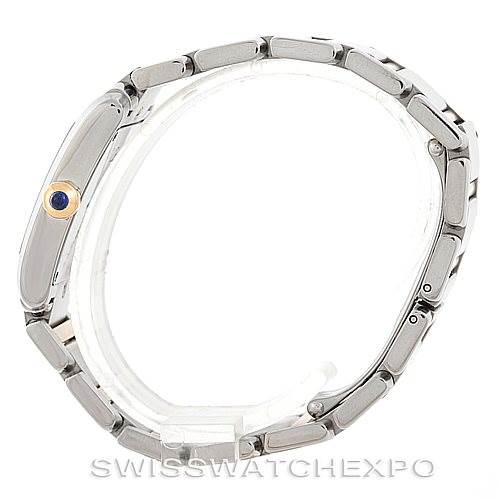 The image shows a side profile view of the Cartier Tank Française watch, featuring the bezel, bracelet, and crown with a blue gemstone.