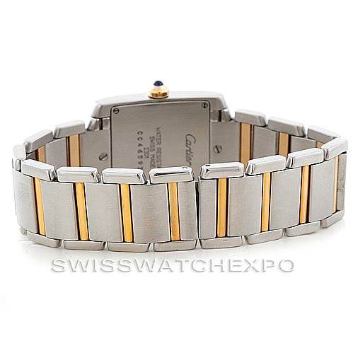 The image shows the back view of a Cartier Tank Française watch, focusing on its two-tone metal bracelet and partially visible case back.
