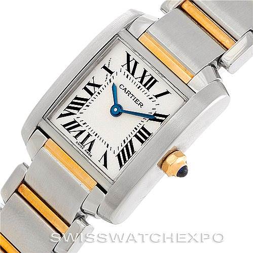 This image shows a Cartier Tank Francaise W51007Q4 Women's Steel and Gold (two tone) Silver Dial W51007Q4 Women's Steel and Gold (two tone) Silver Dial watch at an angled view, highlighting its face, Roman numerals, and a portion of its metal and gold bracelet.