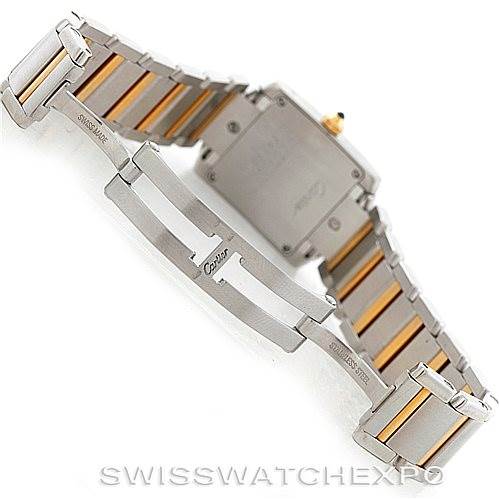 The image shows the clasp and underside of the bracelet of a Cartier Tank Française watch, displaying part of the case back as well.
