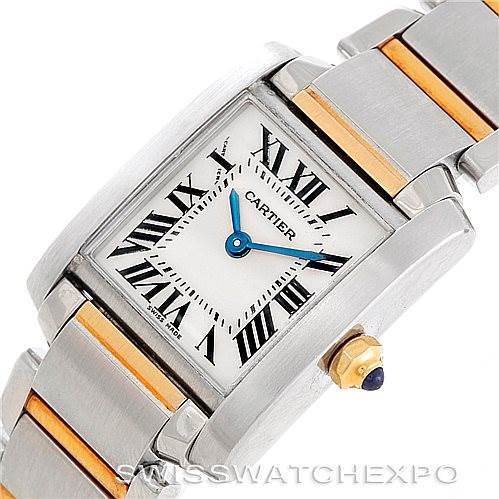 This image shows a close-up of the Cartier Tank Française watch face, highlighting the Roman numerals, blue hands, and bracelet links.