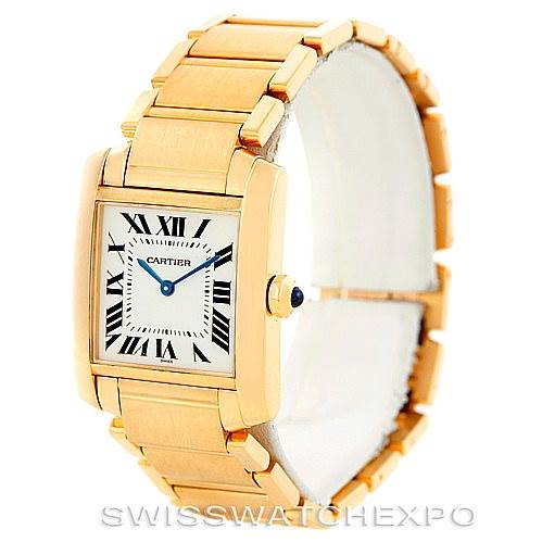This image shows the Cartier Tank Francaise W50003N2 Women's Yellow Gold Silver Dial W50003N2 Women's Yellow Gold Silver Dial watch at a partial side-angle, highlighting its gold bracelet and square face with Roman numerals.