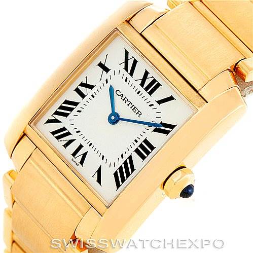 The image shows a close-up view of the Cartier Tank Française watch, highlighting the dial, hour markers, and part of the bracelet.