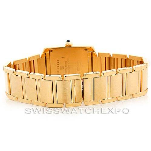 The image shows the back view of a Cartier Tank Francaise W50003N2 Women's Yellow Gold Silver Dial W50003N2 Women's Yellow Gold Silver Dial watch, highlighting its gold bracelet and clasp.
