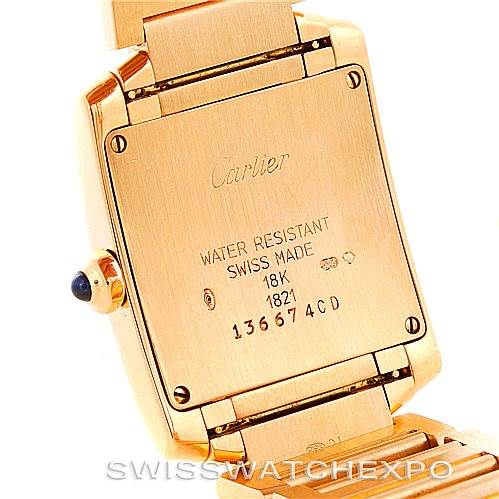 This image shows the back of the Cartier Tank Française watch, focusing on the case back and part of the gold bracelet.