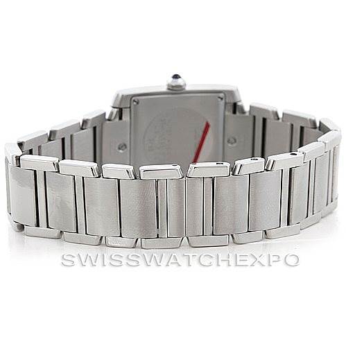 The image shows the back view of a Cartier Tank Francaise W51011Q3 Women's Stainless Steel Silver Dial W51011Q3 Women's Stainless Steel Silver Dial watch and its metal bracelet.