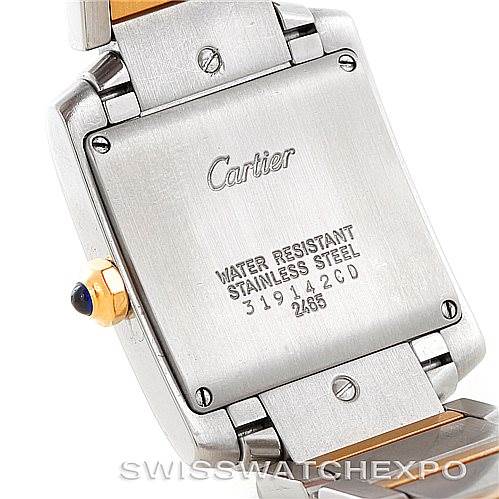 The image shows the backside of a Cartier Tank Française watch, highlighting its stainless steel case and water resistance markings.