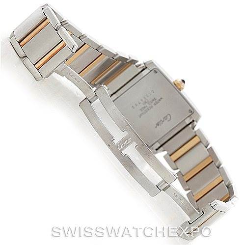 The image shows the back side and bracelet of a Cartier Tank Française watch, highlighting the clasp and two-tone metal links.