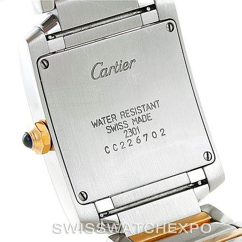 This image shows the back case and part of the bracelet of a Cartier Tank Française watch.