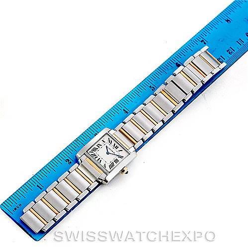 The image shows a Cartier Tank Francaise Women's Steel and Gold (two tone) Silver Dial Women's Steel and Gold (two tone) Silver Dial watch laid flat next to a blue ruler for size comparison.