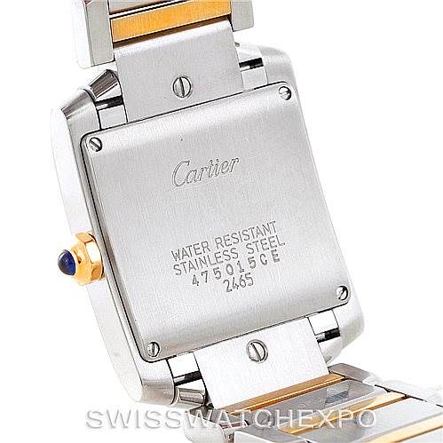 The image shows the back case of a Cartier Tank Francaise W51012Q4 Women's Steel and Gold (two tone) Silver Dial W51012Q4 Women's Steel and Gold (two tone) Silver Dial watch along with part of its metal bracelet.