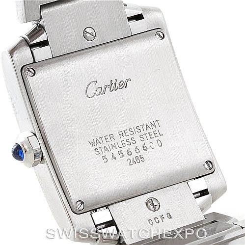 This image shows the back case and part of the bracelet of a Tank Française model by Cartier, highlighting its stainless steel construction and water resistance details.