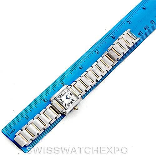 The Cartier Tank Francaise W51007Q4 Women's Steel and Gold (two tone) Silver Dial W51007Q4 Women's Steel and Gold (two tone) Silver Dial watch is shown laid out flat next to a blue ruler, displaying its bracelet and square face.