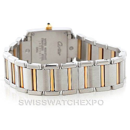 The image shows the back view of a Tank Francaise model by Cartier, highlighting the two-tone bracelet and case back details.