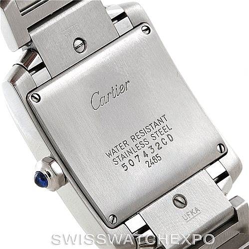 The image shows the backside of a Cartier Tank Française watch, highlighting the case back, brand engraving, and bracelet clasp.