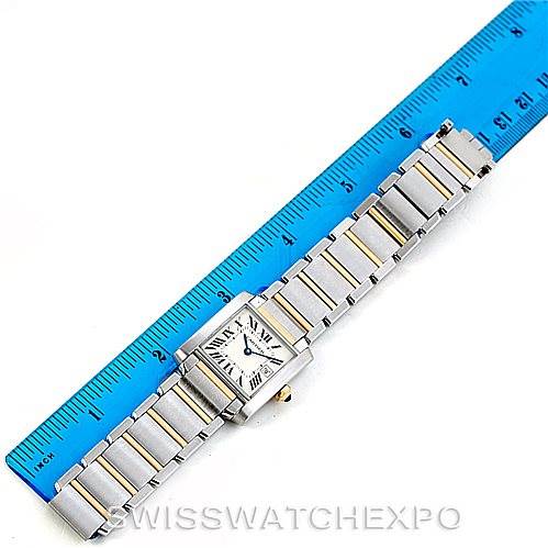 The Cartier Tank Francaise W51012Q4 Women's Steel and Gold (two tone) Silver Dial W51012Q4 Women's Steel and Gold (two tone) Silver Dial watch is shown from the top view, highlighting its bracelet alongside a measuring ruler.