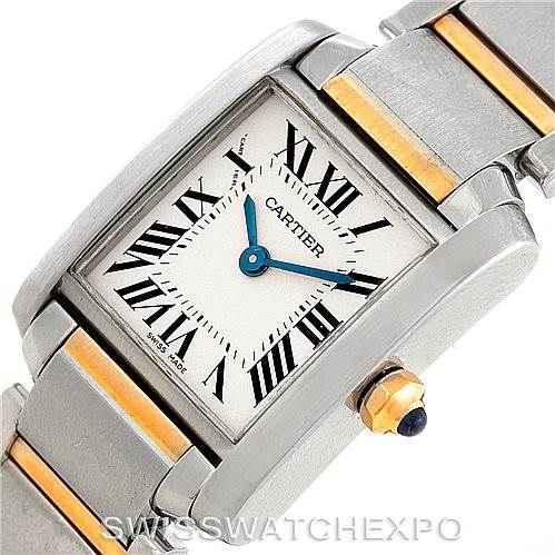 This image shows a close-up of the Cartier Tank Francaise W51007Q4 Women's Steel and Gold (two tone) Silver Dial W51007Q4 Women's Steel and Gold (two tone) Silver Dial watch, highlighting its face, bezel, and part of its stainless steel and gold bracelet.