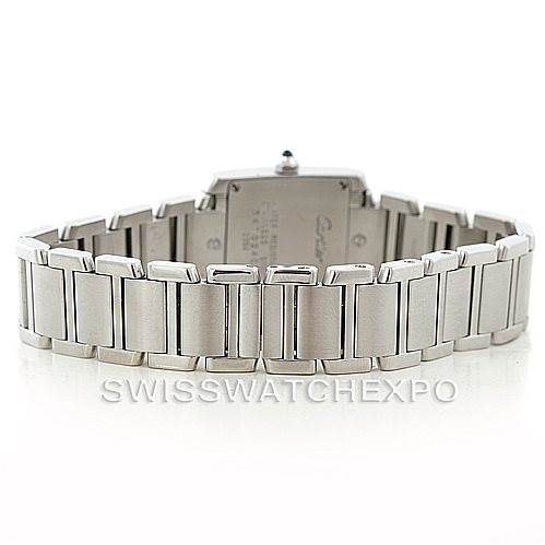 The image shows the back view of a Cartier Tank Française watch, focusing on the stainless steel bracelet and clasp.