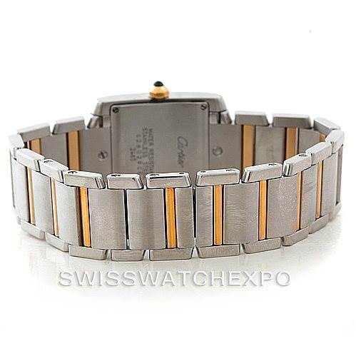 This image shows the back view of a Cartier Tank Française watch, highlighting its metal bracelet with gold accents.