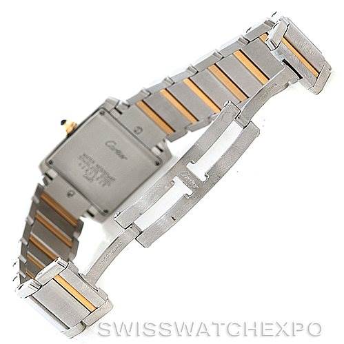 The Cartier Tank Française watch is shown from the rear, highlighting the back case and two-tone metal bracelet.