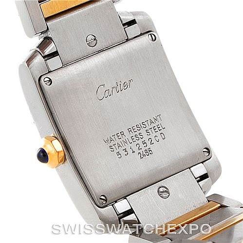 This image shows the back case of a Cartier Tank Française watch with its engraved details and part of the metal bracelet.