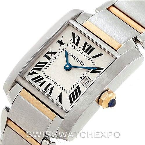 The image shows a close-up angle of a Cartier Tank Française watch, highlighting its face, Roman numeral markers, and part of the bracelet.