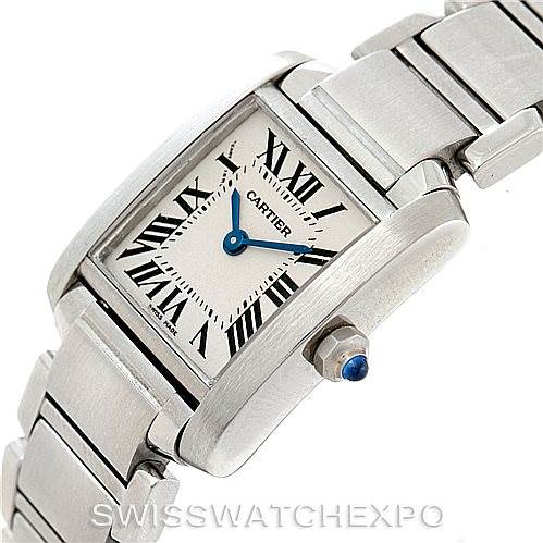 The Cartier Tank Française watch is shown at an angle highlighting the rectangular face, bezel, bracelet, and crown with a blue gem.