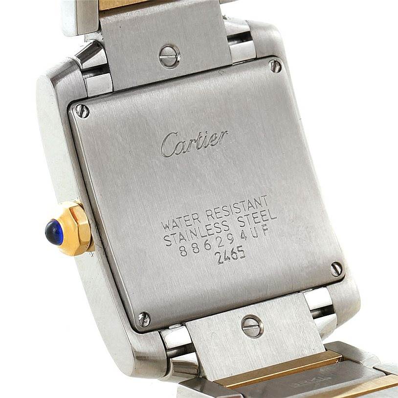 The image shows the back case and part of the bracelet of a Cartier Tank Francaise W51012Q4 Women's Steel and Gold (two tone) Silver Dial W51012Q4 Women's Steel and Gold (two tone) Silver Dial watch, highlighting its stainless steel and water-resistant features.