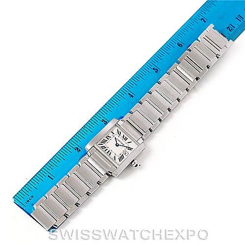 The image shows a Cartier Tank Francaise W51011Q3 Women's Stainless Steel Silver Dial W51011Q3 Women's Stainless Steel Silver Dial watch placed flat against a ruler, showcasing the entire watch and its stainless steel bracelet.