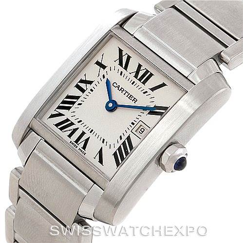 The image shows a Cartier Tank Francaise W51011Q3 Women's Stainless Steel Silver Dial W51011Q3 Women's Stainless Steel Silver Dial watch at an angle, highlighting the face, bracelet, and crown with a blue gem.