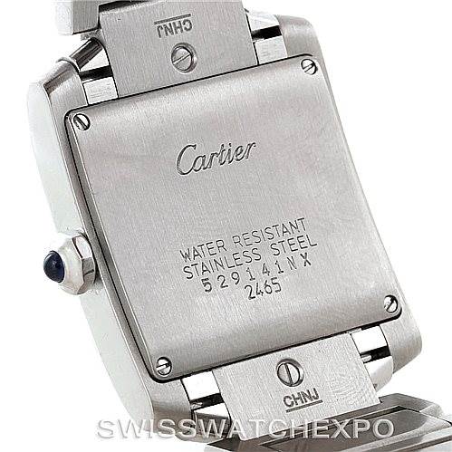 The image shows the back case and part of the band of a Cartier Tank Francaise W51011Q3 Women's Stainless Steel Silver Dial W51011Q3 Women's Stainless Steel Silver Dial watch, highlighting the engravings and screws.