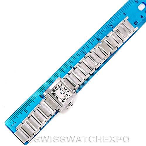 This image shows a Cartier Tank Francaise W51011Q3 Women's Stainless Steel Silver Dial W51011Q3 Women's Stainless Steel Silver Dial watch laid flat next to a blue ruler for scale.