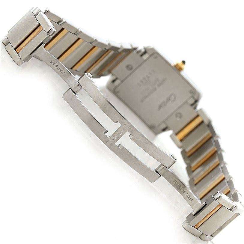 The image shows the underside and clasp of the Cartier Tank Francaise W51007Q4 Women's Steel and Gold (two tone) Silver Dial W51007Q4 Women's Steel and Gold (two tone) Silver Dial watch with parts of its stainless steel and gold bracelet.