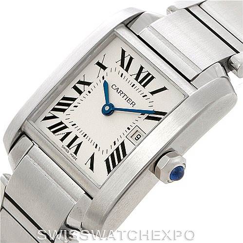 The image shows a Cartier Tank Francaise W51011Q3 Women's Stainless Steel Silver Dial W51011Q3 Women's Stainless Steel Silver Dial watch from a three-quarter angle, highlighting the face, bracelet, and crown with a blue sapphire cabochon.