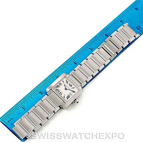 The Cartier Tank Francaise W51011Q3 Women's Stainless Steel Silver Dial W51011Q3 Women's Stainless Steel Silver Dial watch is shown from a top-down angle alongside a blue ruler for scale.