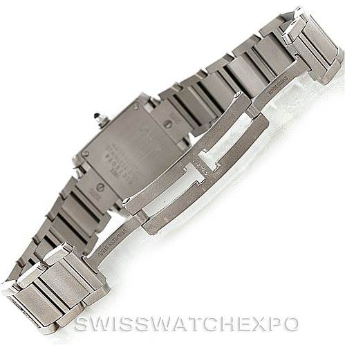 The image shows the back angle of a Cartier Tank Française watch, focusing on its metal bracelet and clasp.