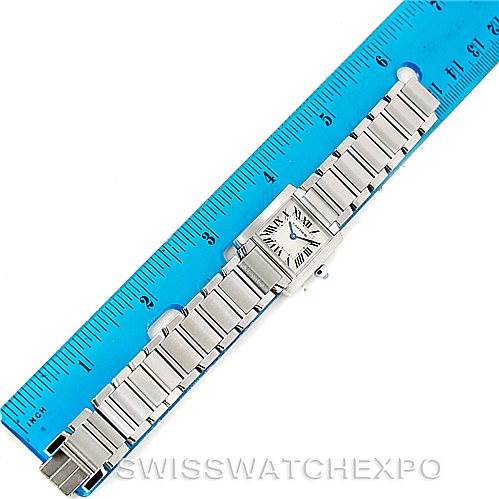 The image shows a top view of a Cartier Tank Francaise W51008Q3 Women's Stainless Steel Silver Dial W51008Q3 Women's Stainless Steel Silver Dial watch, displayed next to a blue ruler for scale.
