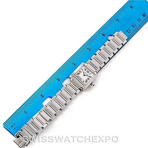 The image shows a Cartier Tank Francaise W51008Q3 Women's Stainless Steel Silver Dial W51008Q3 Women's Stainless Steel Silver Dial watch lying flat next to a blue ruler for measurement.