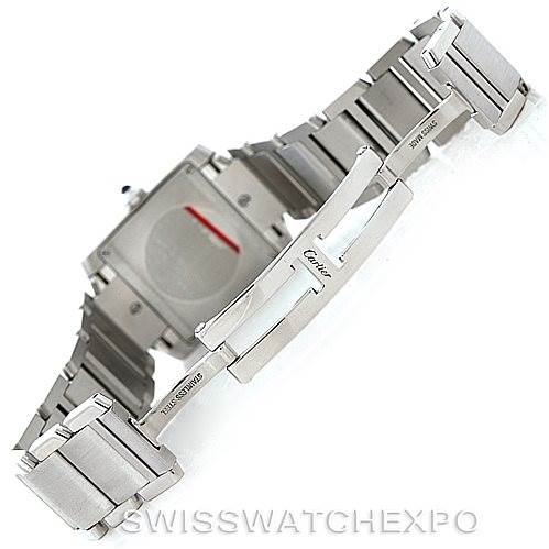 The image shows the back side and clasp mechanism of a Cartier Tank Française watch, featuring its stainless steel bracelet.