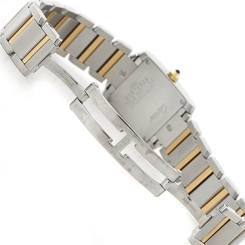 The image shows the back and clasp area of the Cartier Tank Française watch, highlighting the stainless steel and gold bracelet.