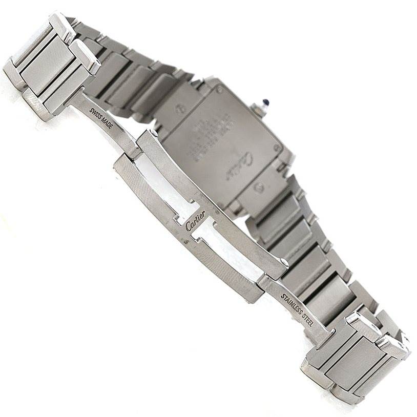The image shows the backside of a Cartier Tank Francaise W51008Q3 Women's Stainless Steel Silver Dial W51008Q3 Women's Stainless Steel Silver Dial watch with a focus on its stainless steel bracelet and clasp.