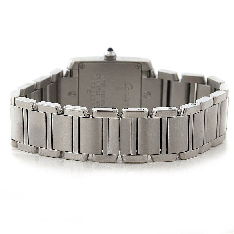 The image shows the backside and the bracelet of a Cartier Tank Française watch.