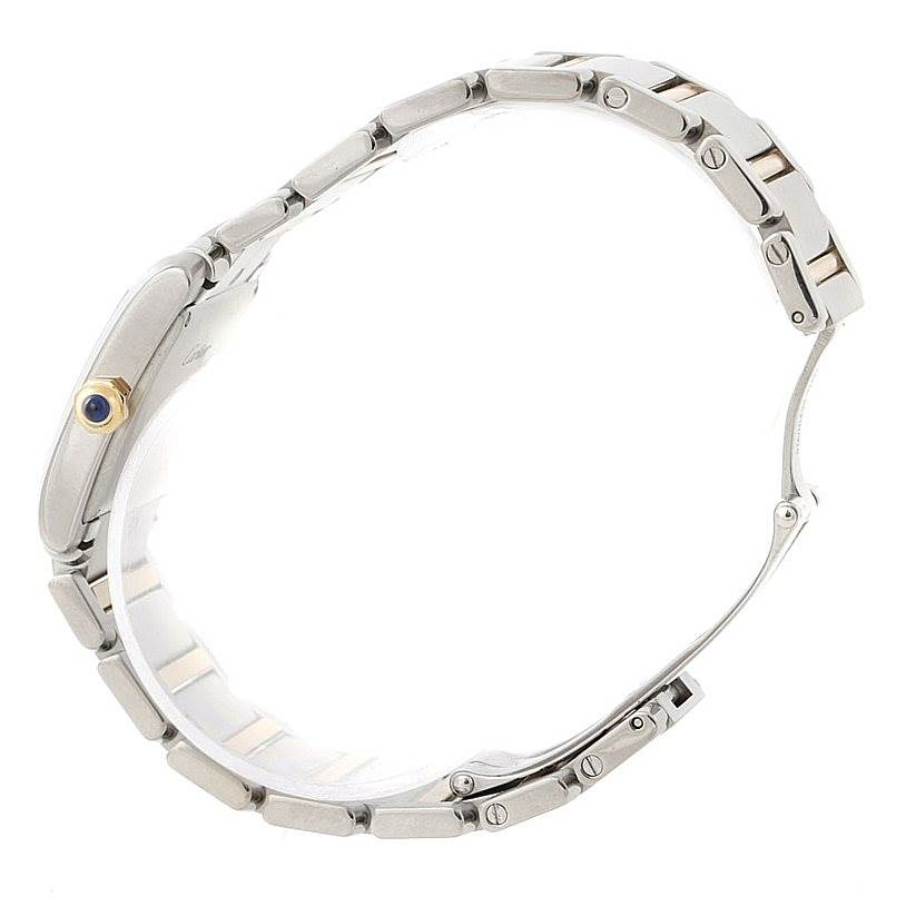 The image shows a side view of the Cartier Tank Française watch, highlighting its bracelet and crown with a blue gemstone.