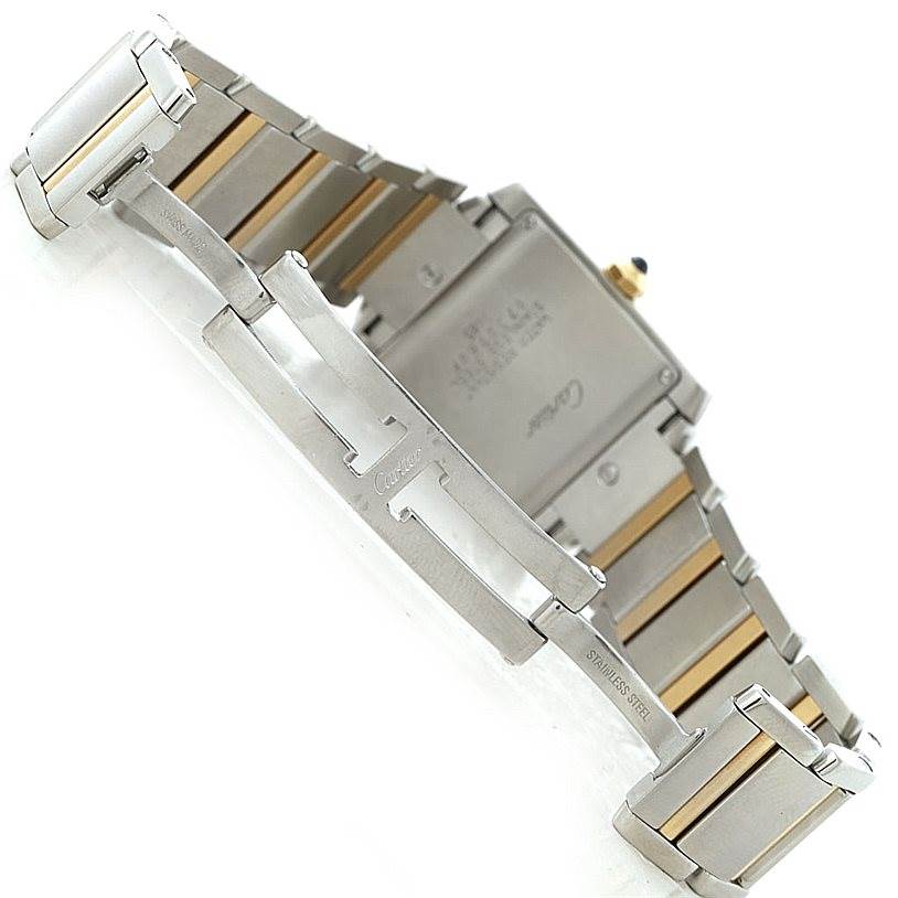 The image shows the back view of a Cartier Tank Francaise W51012Q4 Women's Steel and Gold (two tone) Silver Dial W51012Q4 Women's Steel and Gold (two tone) Silver Dial watch, highlighting the clasp and part of the metal bracelet.
