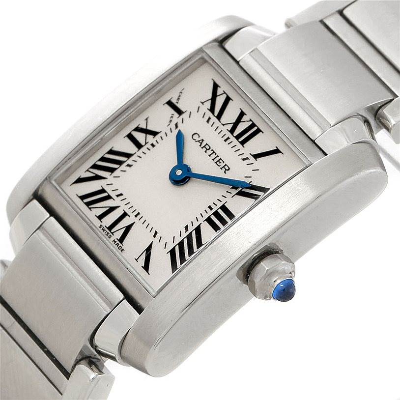The image shows a close-up of a Cartier Tank Francaise W51008Q3 Women's Stainless Steel Silver Dial W51008Q3 Women's Stainless Steel Silver Dial watch at an angle, highlighting the dial with Roman numerals, blue hands, and metal bracelet.