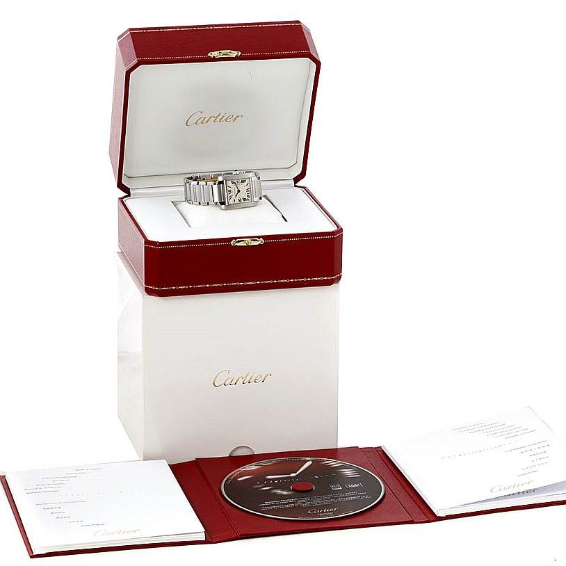 The image shows a Cartier Tank Francaise W51011Q3 Women's Stainless Steel Silver Dial W51011Q3 Women's Stainless Steel Silver Dial watch in its open display box, along with a CD and booklet.
