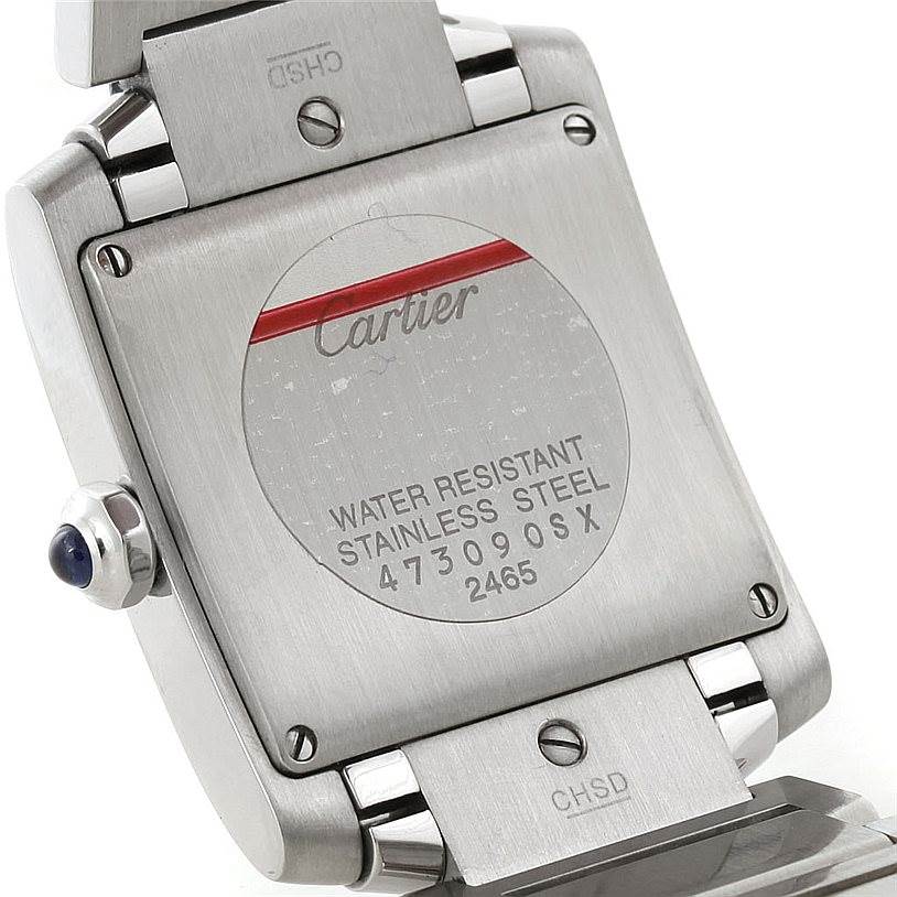 The image shows the back case and part of the clasp of a Cartier Tank Francaise W51011Q3 Women's Stainless Steel Silver Dial W51011Q3 Women's Stainless Steel Silver Dial watch engraved with brand details and specifications.